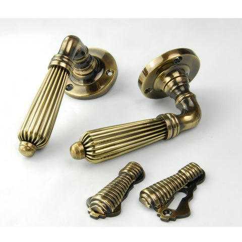 Regency Style Reeded Lever Door Handles & Escutcheons Aged Brass