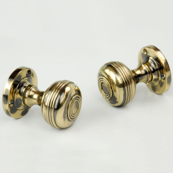 Regency Bloxwich Solid Antique Brass Door Knobs on a Rose with Escutcheons