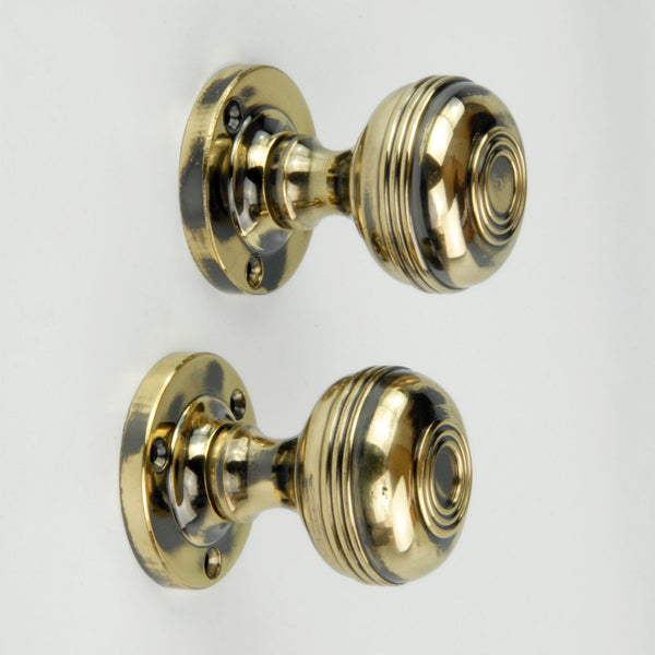 Regency Bloxwich Solid Antique Brass Door Knobs on a Rose with Escutcheons