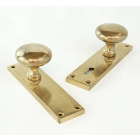 Aged Unlacquered Solid Brass New York Round Door Knobs Handles on Backplate