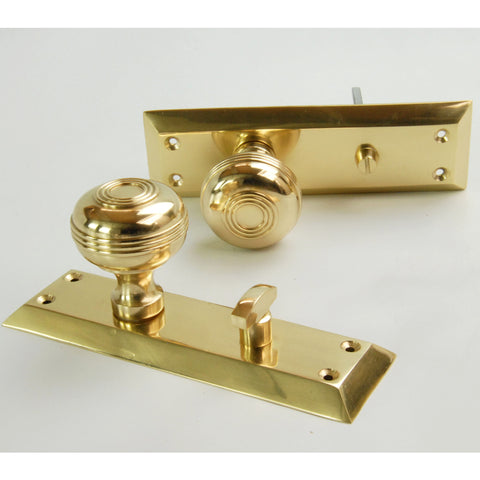 Bellport Polished Solid Brass Round Bathroom Door Knobs on a Long Backplate