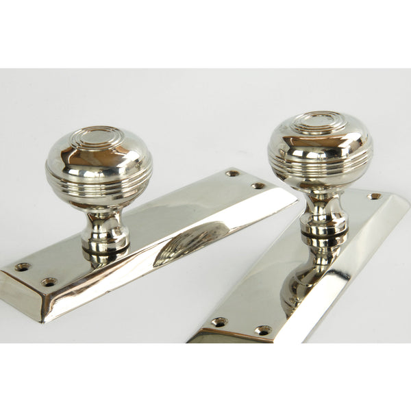 Bellport Polished Nickel Solid Brass Round Door Knobs on a Long Backplate