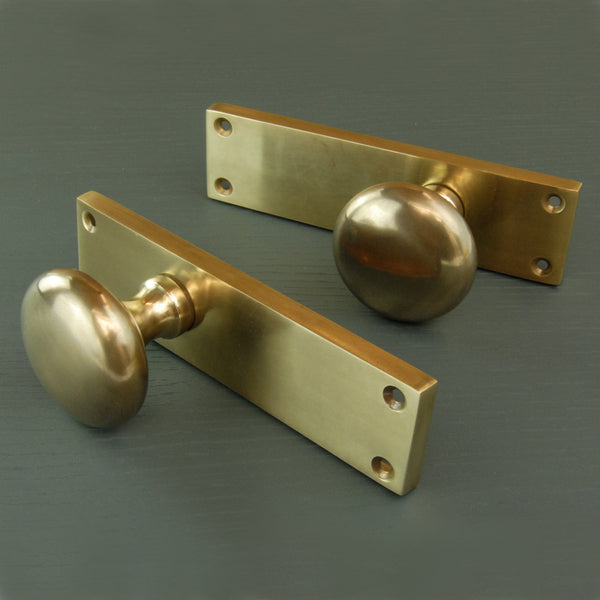 Aged Unlacquered Solid Brass New York Round Door Knobs Handles on Backplate