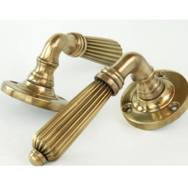 Aged Unlacquered Solid Brass Vintage Regency Reeded Lever Door Handles