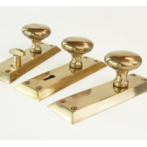 Aged Unlacquered Solid Brass Newport Round Door Knobs Handles on Long Backplate