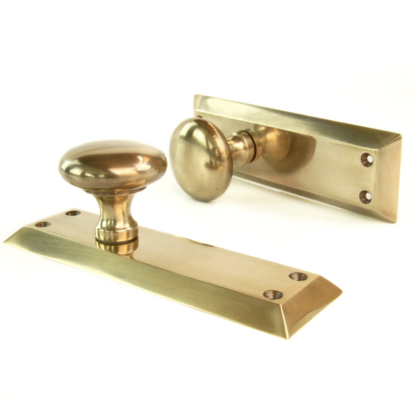 Aged Unlacquered Solid Brass Newport Round Door Knobs Handles on Long Backplate