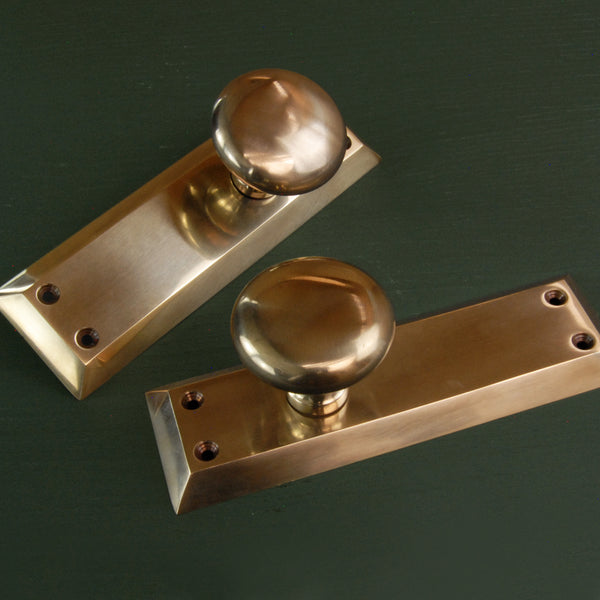 Aged Unlacquered Solid Brass Newport Round Door Knobs Handles on Long Backplate