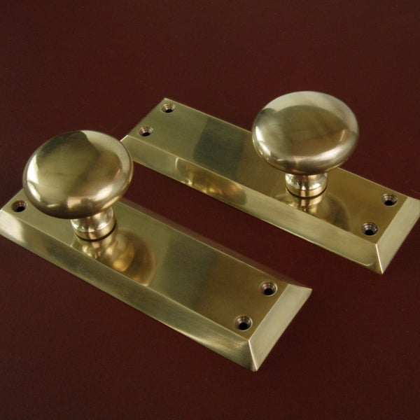 Aged Unlacquered Solid Brass Newport Round Door Knobs Handles on Long Backplate