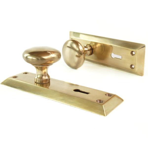Aged Unlacquered Solid Brass Newport Round Door Knobs Handles on Long Backplate
