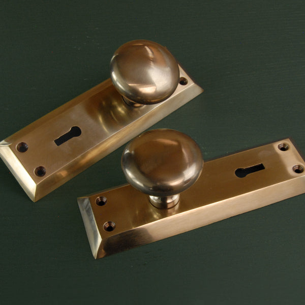 Aged Unlacquered Solid Brass Newport Round Door Knobs Handles on Long Backplate