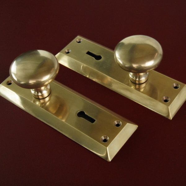 Aged Unlacquered Solid Brass Newport Round Door Knobs Handles on Long Backplate