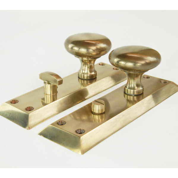 Aged Unlacquered Solid Brass Newport Round Door Knobs Handles on Long Backplate