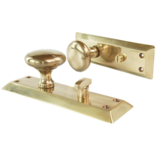 Aged Unlacquered Solid Brass Newport Round Door Knobs Handles on Long Backplate