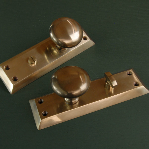 Aged Unlacquered Solid Brass Newport Round Door Knobs Handles on Long Backplate