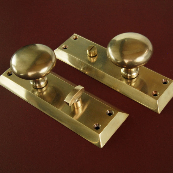 Aged Unlacquered Solid Brass Newport Round Door Knobs Handles on Long Backplate