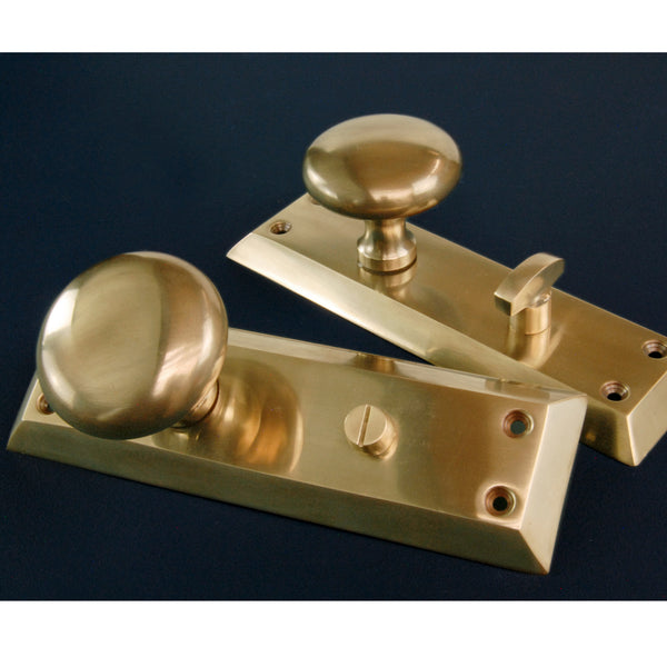 Aged Unlacquered Solid Brass Newport Round Door Knobs Handles on Long Backplate