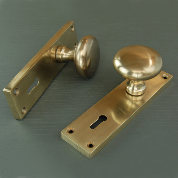 Aged Unlacquered Solid Brass New York Round Door Knobs Handles on Backplate