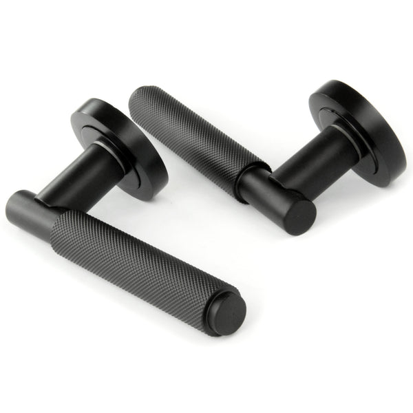 Satin Matt Black Knurled Door Lever Handles on a Round Rose