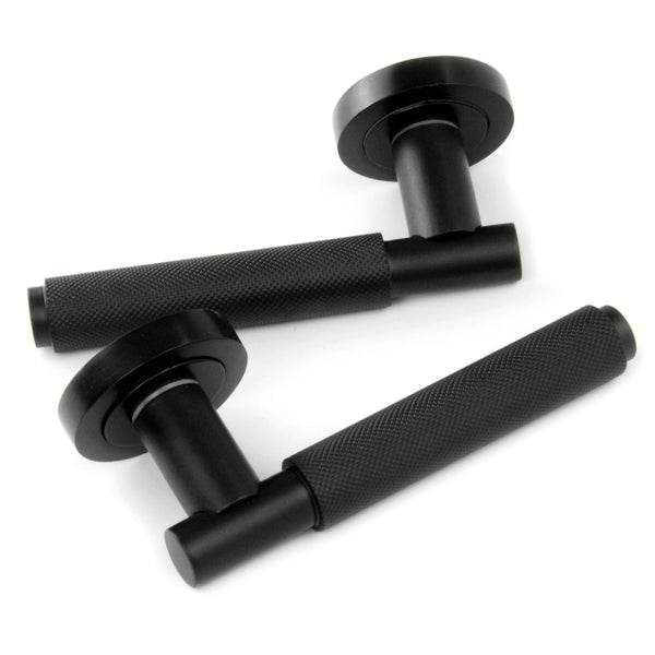 Satin Matt Black Knurled Door Lever Handles on a Round Rose