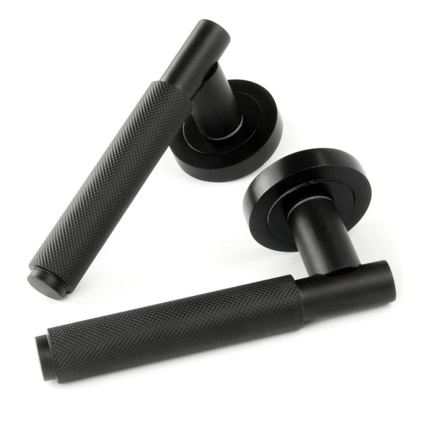 Satin Matt Black Knurled Door Lever Handles on a Round Rose