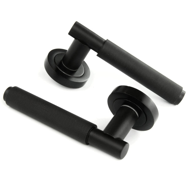 Satin Matt Black Knurled Door Lever Handles on a Round Rose