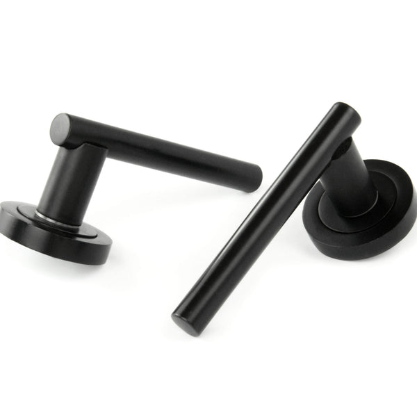 London T Bar Round Door Lever Handles on a Round Rose in Satin Black
