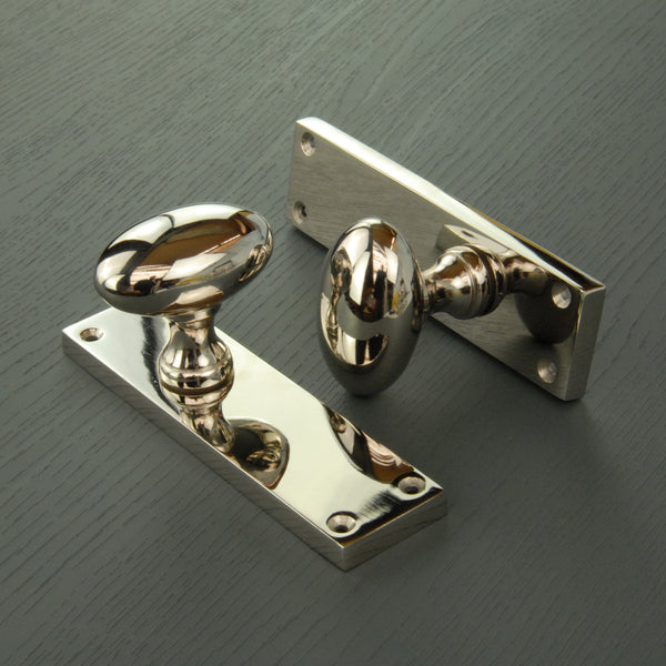 New York Door Knobs Oval Round Handles on Backplate Polished Nickel