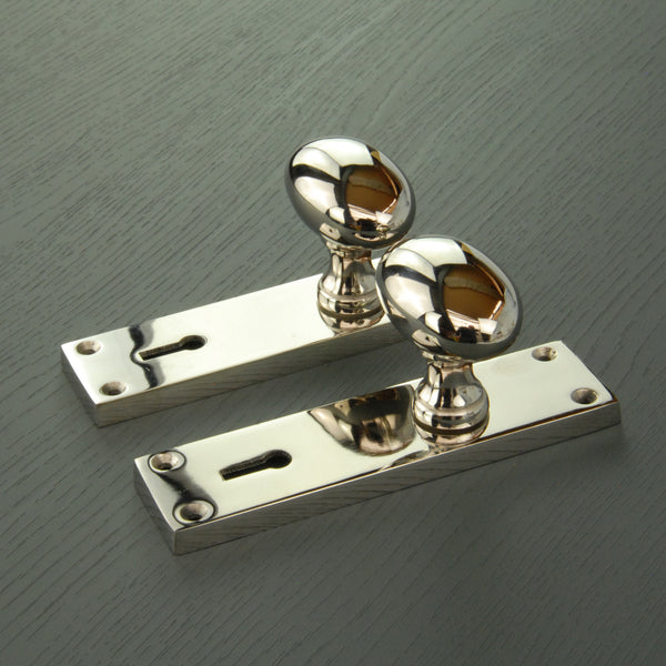 New York Door Knobs Oval Round Handles on Backplate Polished Nickel