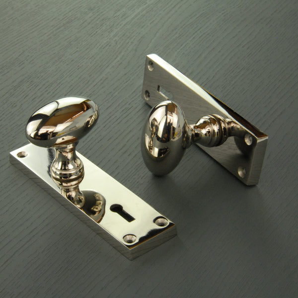 New York Door Knobs Oval Round Handles on Backplate Polished Nickel