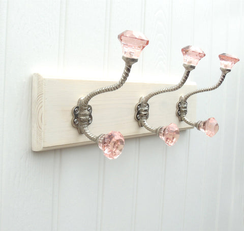 A Vintage Style Wooden Wall Storage Hook Rack with 3 Pink Glass Hooks