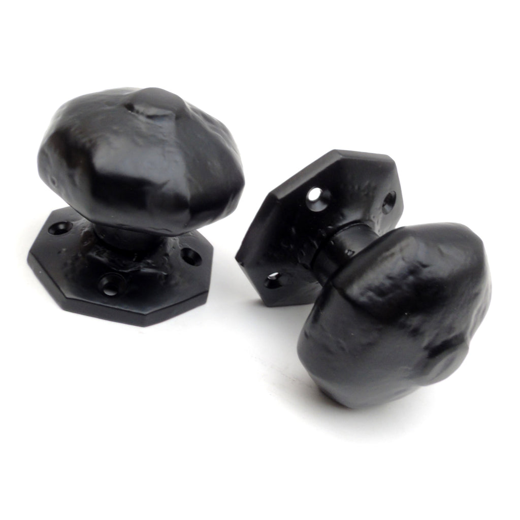 A pair of Vintage Old Fashioned Rustic Black Octagonal Door Knobs Latch Door Handles on Sprung Backplate