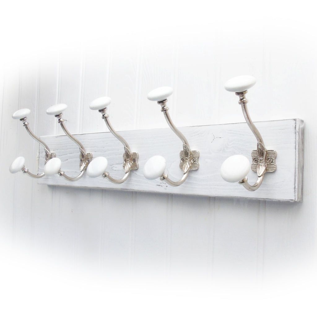 A Shabby Chic Distressed White Wooden Coat Rack with White