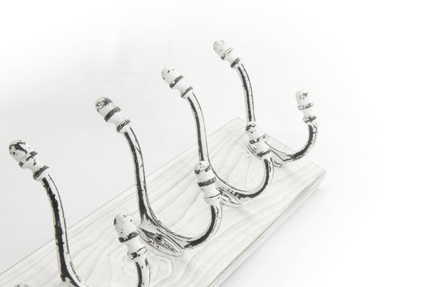 A Distressed White Wooden Coat Rack with 5 Cast Iron Hooks