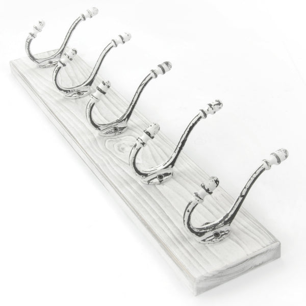 A Distressed White Wooden Coat Rack with 5 Cast Iron Hooks