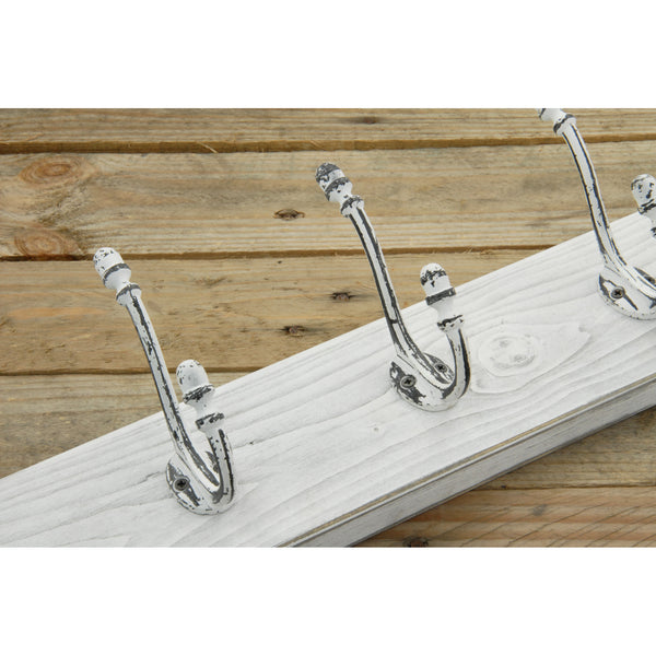 A Distressed White Wooden Coat Rack with 5 Cast Iron Hooks