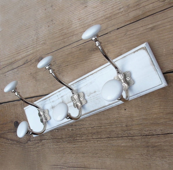 A Shabby Chic Distressed White Coat Hook Rack with 3 Cast Iron Hooks